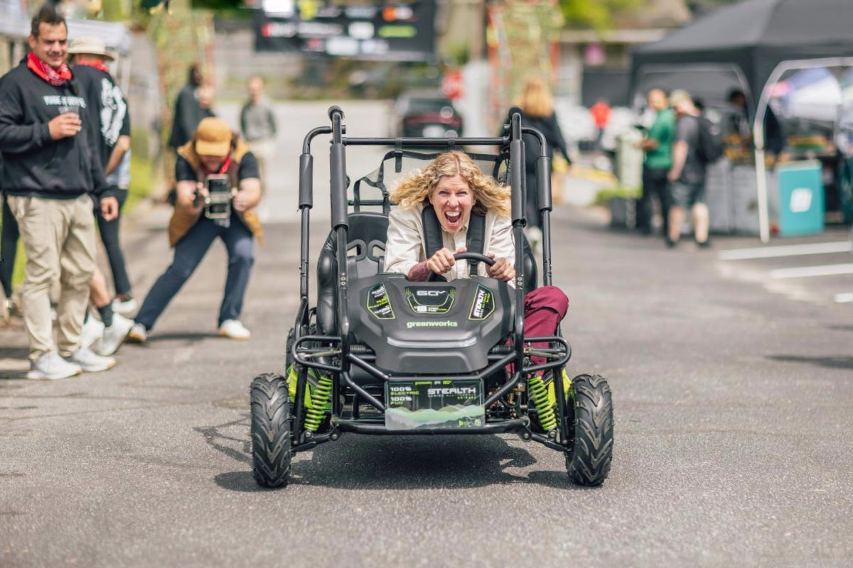 Greenworks electric go-kart — driver smiling on the track